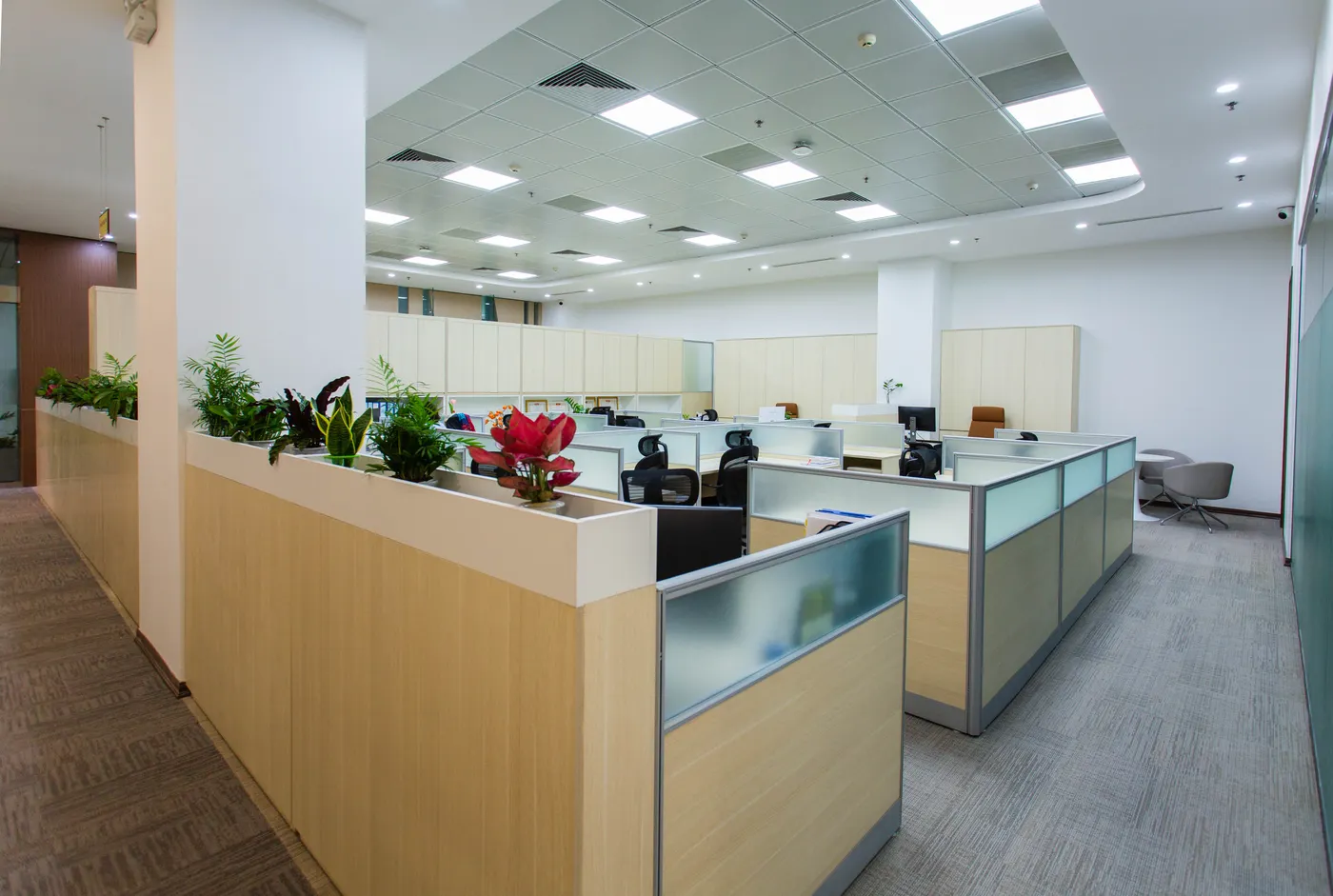 Modern corporate office interior with ceiling-mounted air conditioning vents