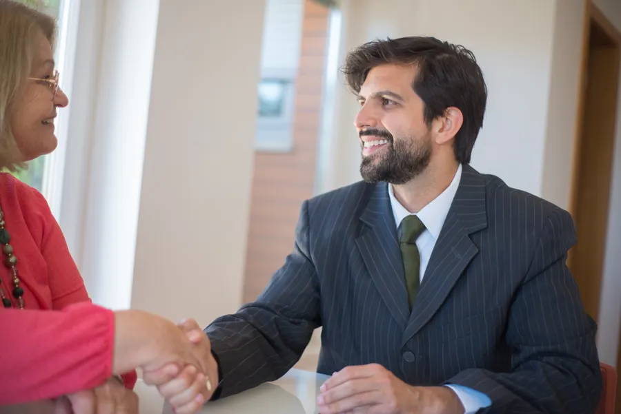 Technician and client shaking hands after a completed service visit